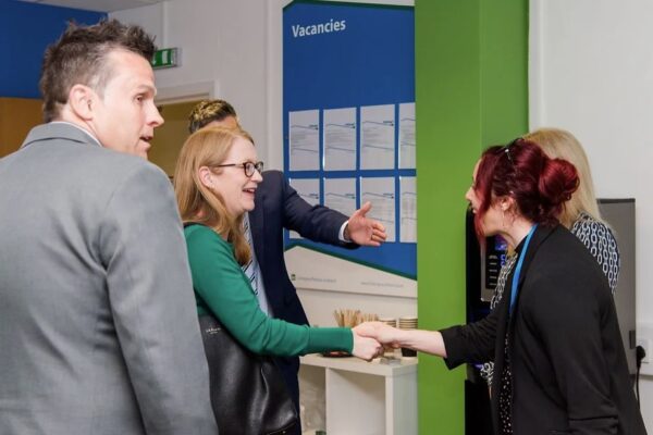 Shirley-Anne Somerville MSP shaking hands with Fedcap Employee