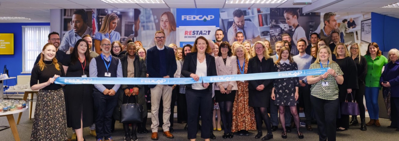 Fedcap employees and customers standing with Victoria Prentis at Banbury opening